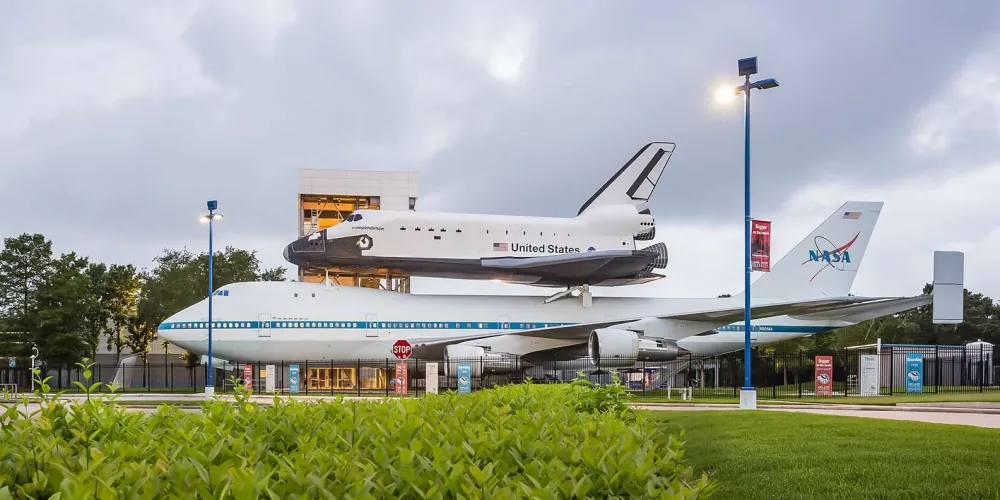 Space shuttle Independence mounted atop the NASA 905 carrier aircraft at Independence Plaza
